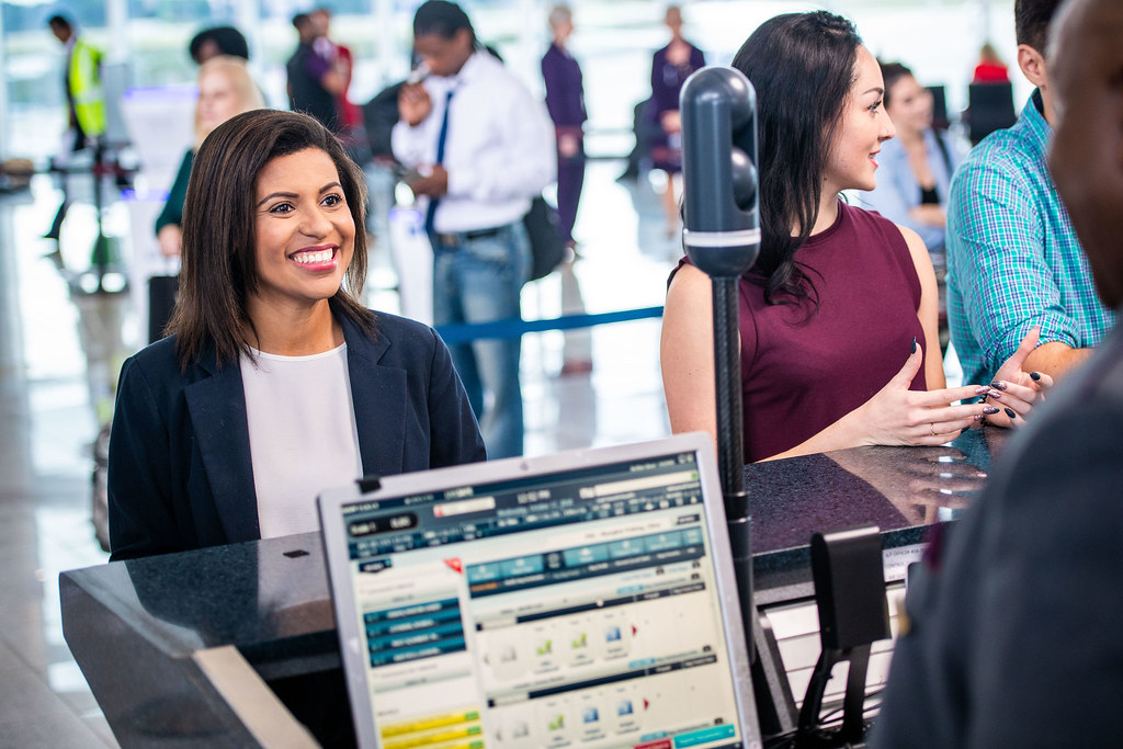 Traveller using facial recognition while dropping off checked baggage