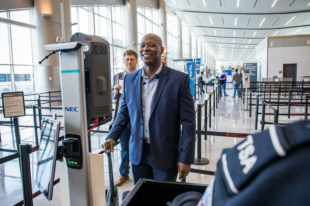 Traveller using facial recognition to verify identity at a security checkpoint